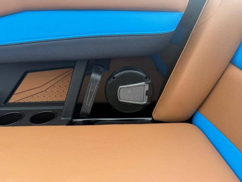 Slide: The Image of Close-up of a boat seat with blue and brown upholstery and a built-in speaker. - 41