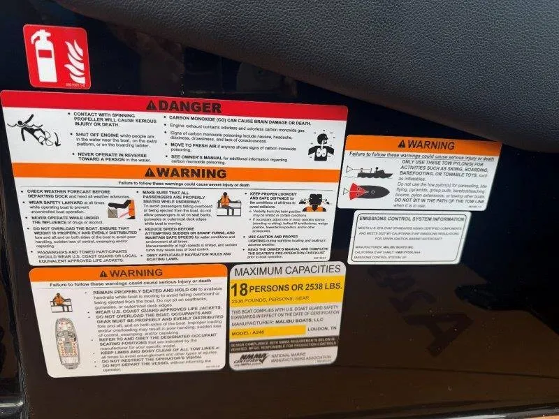 Slide: The Image of Safety and warning labels on a boat with a maximum capacity of 18 persons or 2538 lbs. - 38