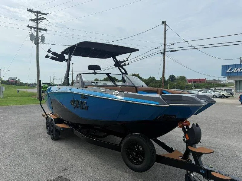 Slide: The Image of A 2027 Axis A245 boat is on a trailer in a parking lot. - 16