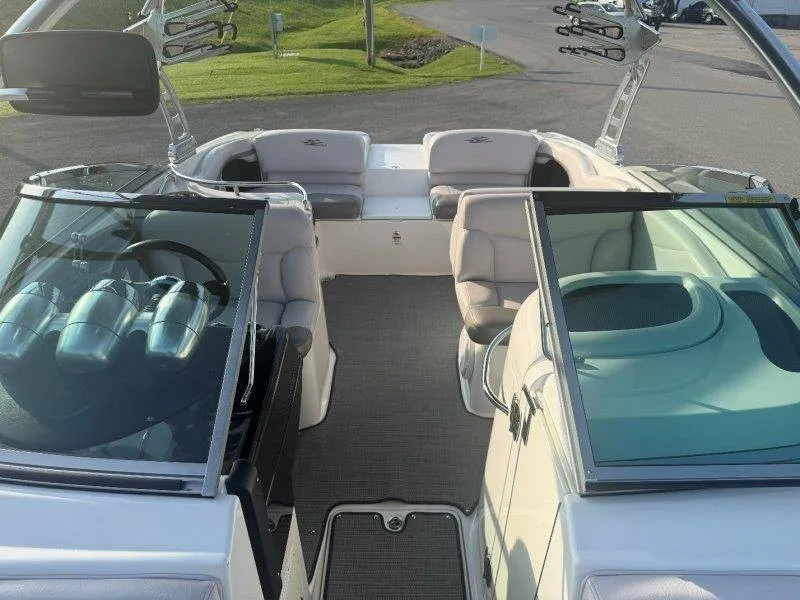Slide: The Image of The image shows the cockpit of a 2006 MasterCraft X-80 boat with gray seats and a modern helm area. - 32