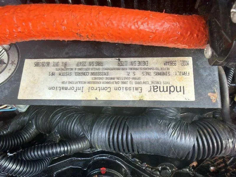 Slide: The Image of Close-up of an engine component with cables and a label displaying technical information. - 41