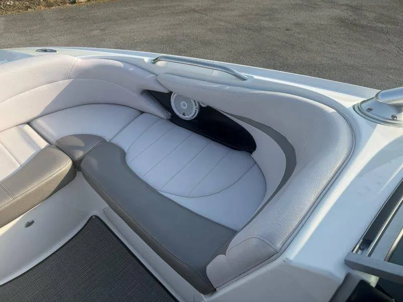 Slide: The Image of The image shows a white and gray seating area in a boat with a speaker. - 35