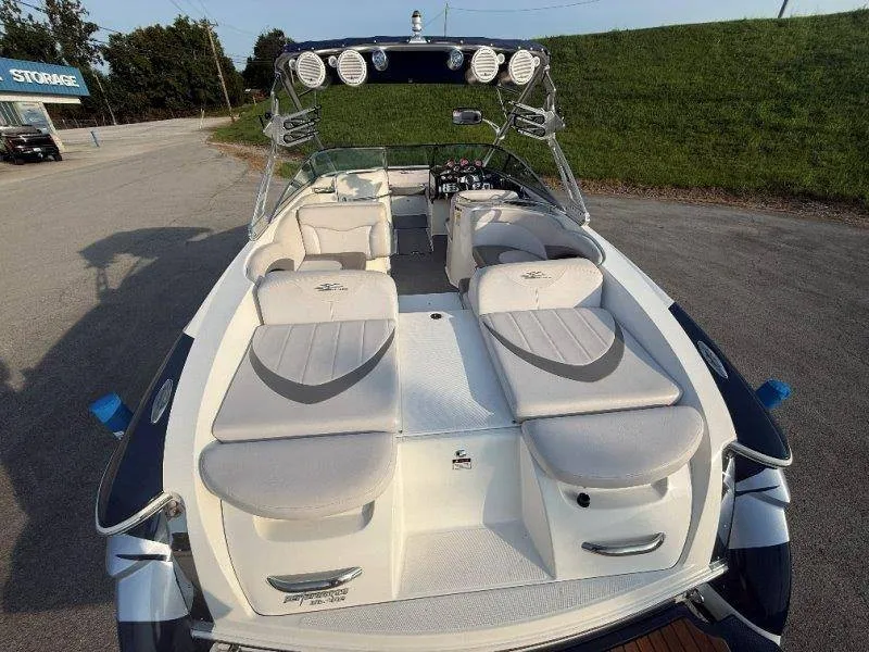 Slide: The Image of The image shows a 2006 MasterCraft X-80 boat with sleek seating and a modern helm. - 44