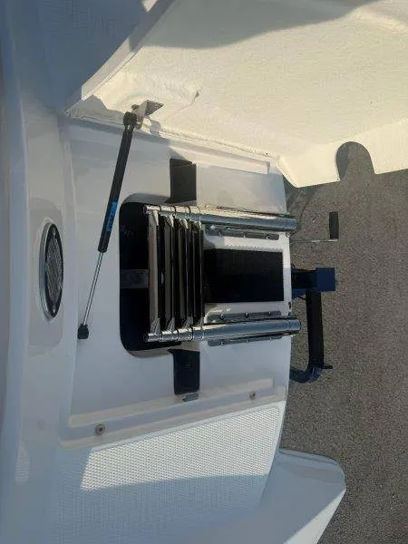 Slide: The Image of A swim ladder is mounted at the stern of a boat, with a hydraulic arm for support. - 23