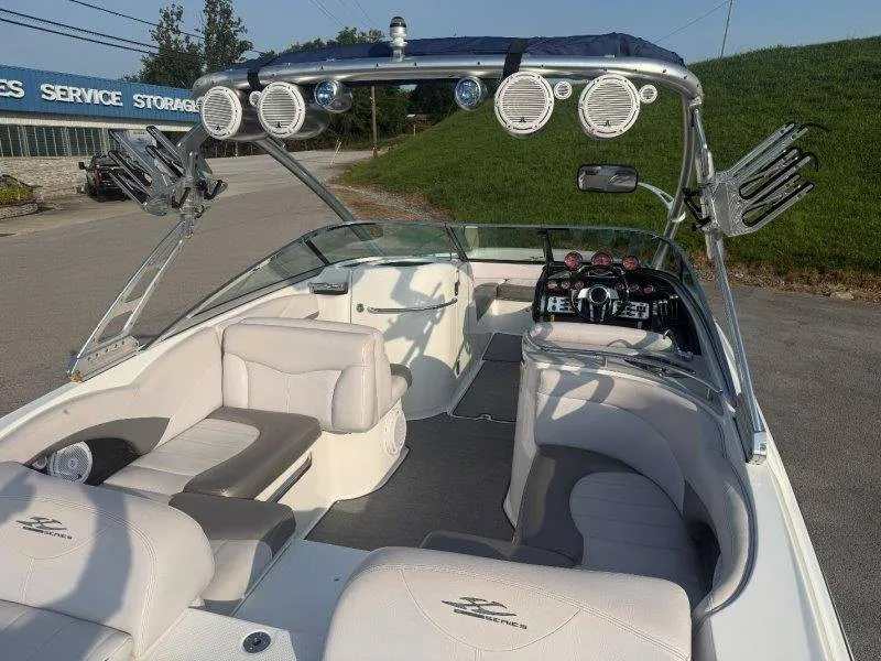 Slide: The Image of The image shows a 2006 MasterCraft X-80 boat with white upholstery and a modern helm. - 18