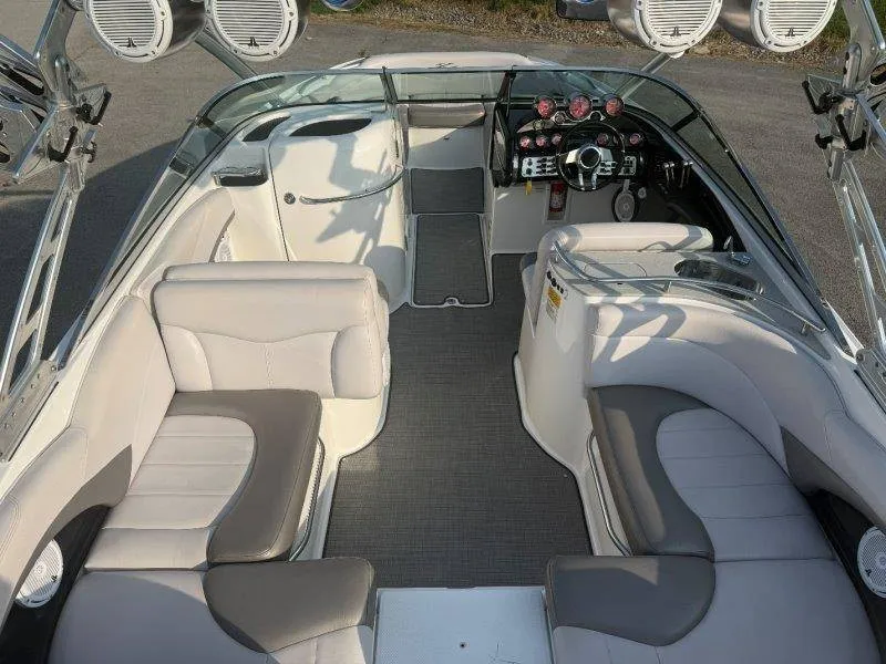 Slide: The Image of The image shows the cockpit of a 2006 MasterCraft X-80 with white and gray seating. - 21