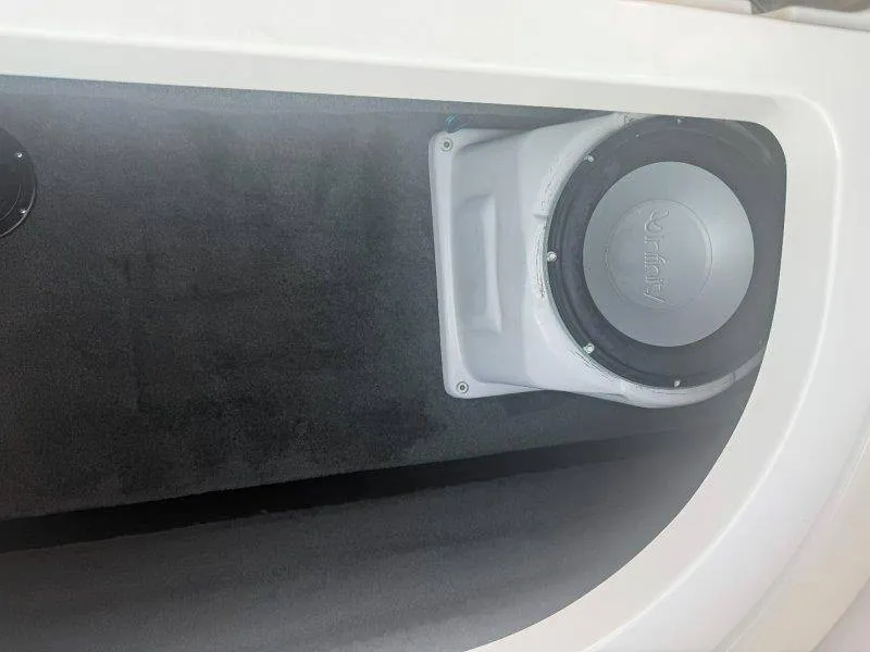 Slide: The Image of A speaker is installed in a white enclosure within a boat. - 25