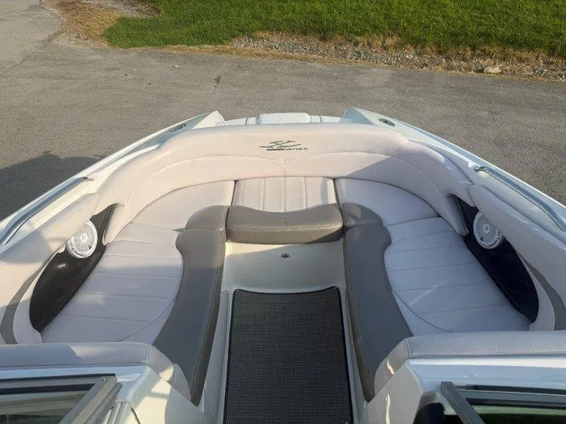 Slide: The Image of The image shows the bow area of a 2006 MasterCraft X-80 boat with white and gray upholstery. - 37