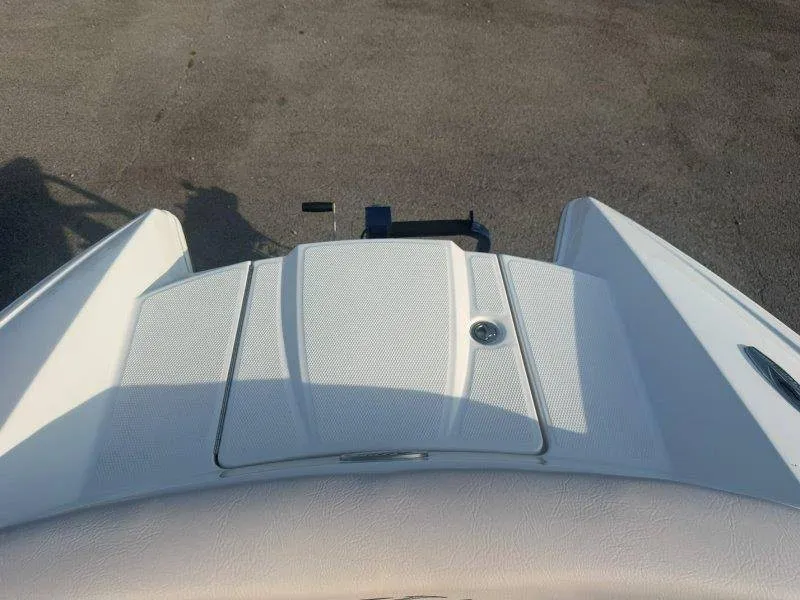 Slide: The Image of The image shows the stern of a 2006 MasterCraft X-80 boat with a white cover. - 39