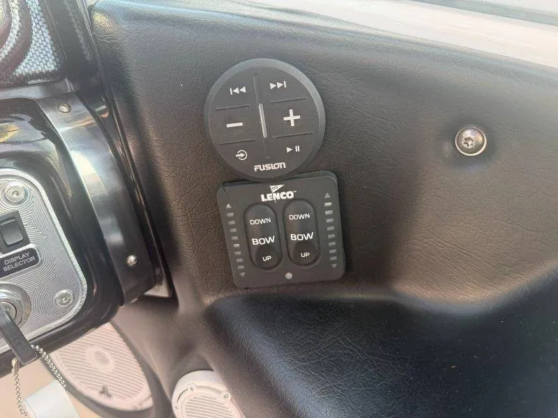 Slide: The Image of Close-up of a 2006 MasterCraft X-80 control panel with audio and trim controls. - 22