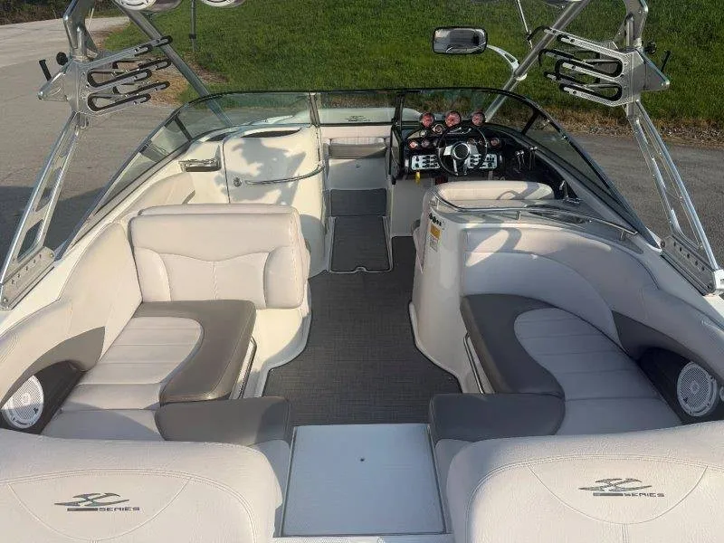 Slide: The Image of The image shows the interior of a 2006 MasterCraft X-80 boat with gray and white seating. - 48