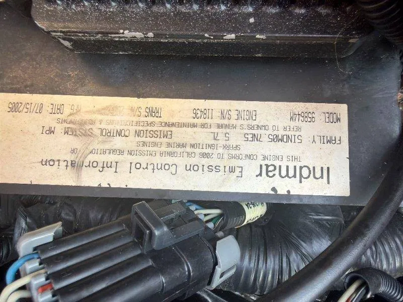 Slide: The Image of Close-up of an emission control system with wires and a label showing technical details. - 38
