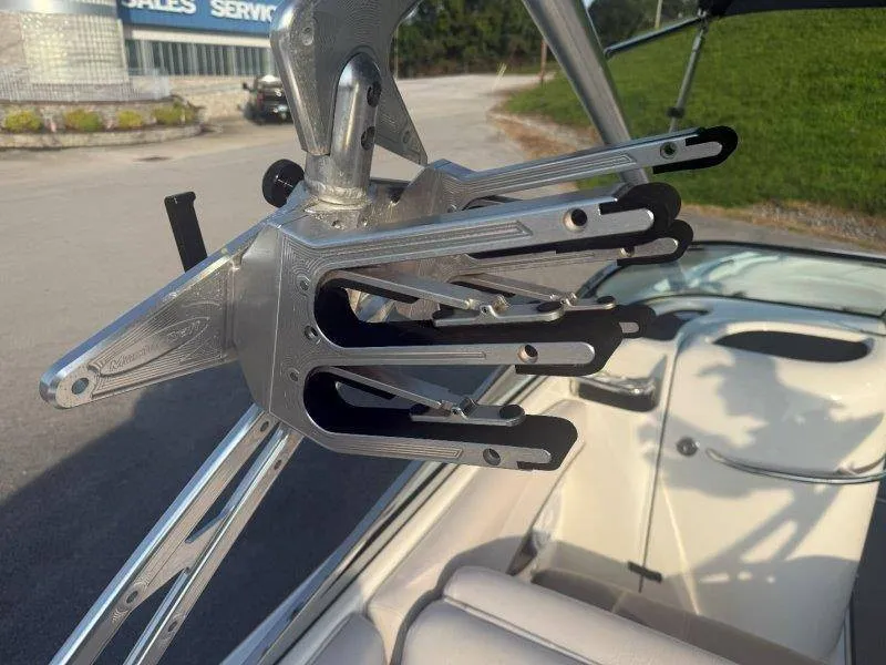 Slide: The Image of A 2006 MasterCraft X-80 featuring a sturdy, metallic wakeboard rack on board. - 50