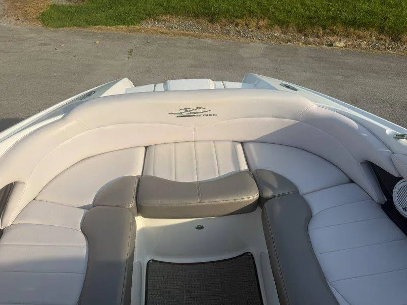 Slide: The Image of The image shows the bow of a 2006 MasterCraft X-80 boat with cushioned seating. - 31