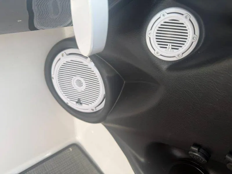 Slide: The Image of Speakers in a boat with black and white interior. - 24