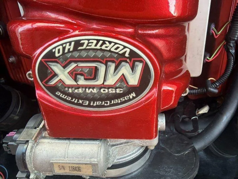 Slide: The Image of Close-up of a red MasterCraft X-80 engine block with MCX logo and technical details. - 40