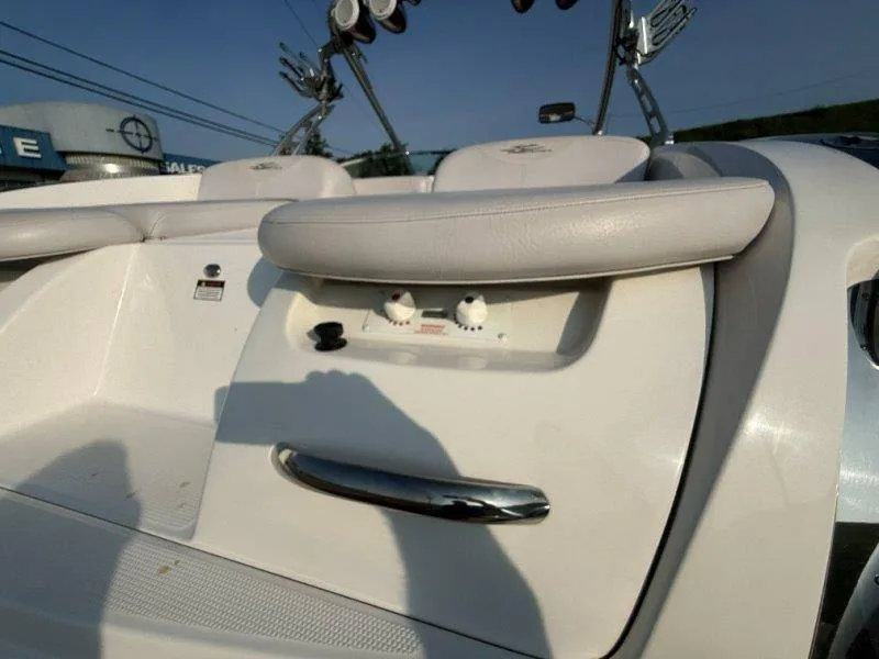 Slide: The Image of Close-up of a white boat seat with control knobs and a handle. - 19