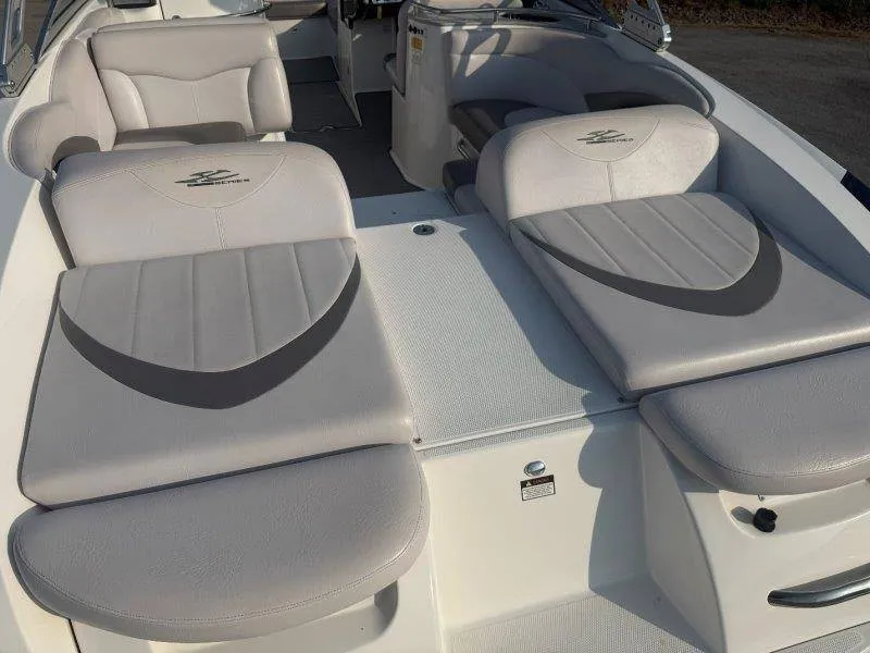 Slide: The Image of The image shows the cockpit of a 2006 MasterCraft X-80 with gray upholstered seats. - 17