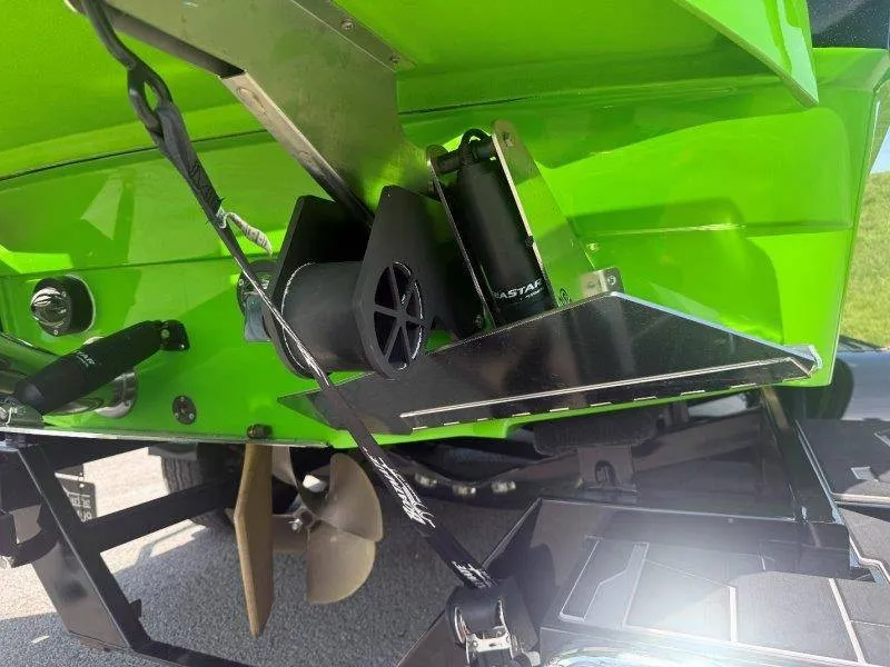 Slide: The Image of Close-up of the green stern of a Supra SE 550 boat with propeller and metal components. - 19