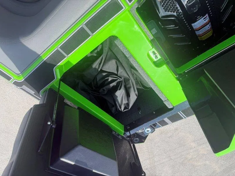 Slide: The Image of A green storage compartment on a boat with black details and an engine. - 40