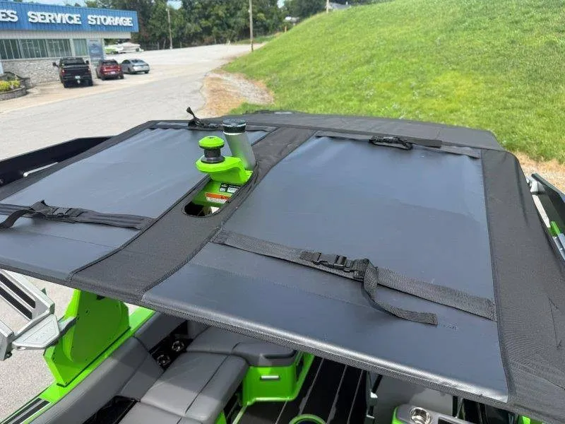 Slide: The Image of The image shows the roof of a 2023 Supra SE 550 boat with black covers. - 29