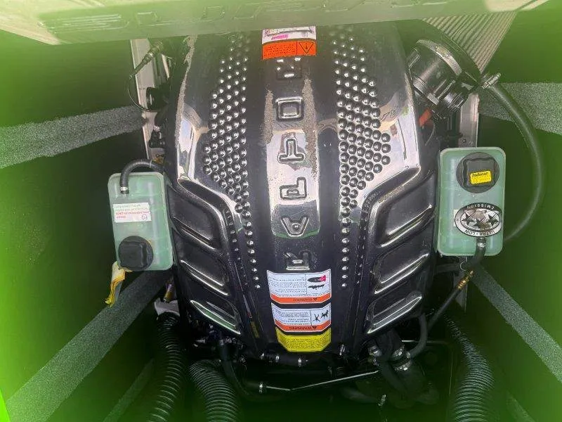 Slide: The Image of Engine compartment of a Supra SE 550 boat with a powerful engine and various components. - 46