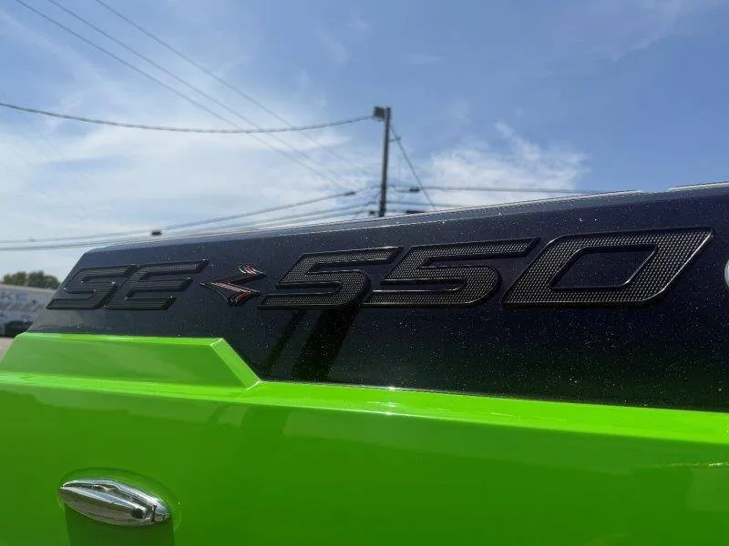 Slide: The Image of Close-up of the Supra SE 550 emblem on a bright green boat. - 18