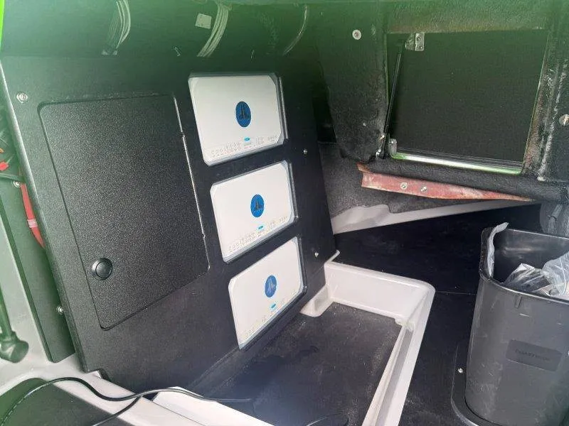 Slide: The Image of Interior view of a boat with electronic control units and wiring. - 50