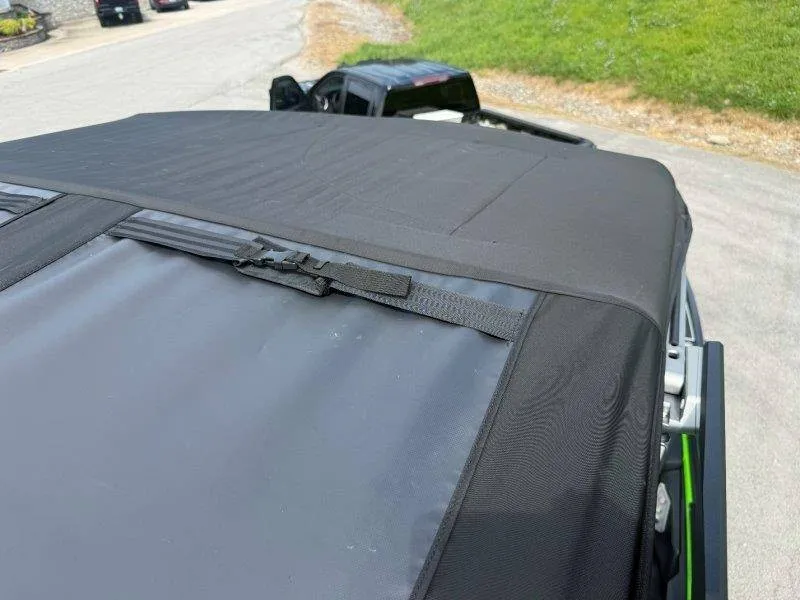 Slide: The Image of The image shows the black cover of a 2023 Supra SE 550 boat. - 34