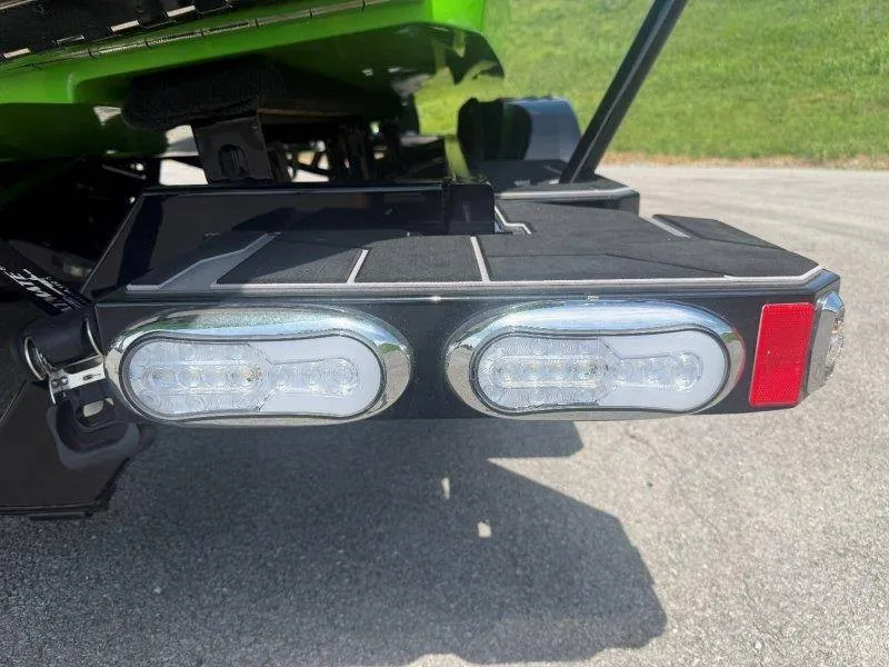 Slide: The Image of Close-up of a green boat's rear with two LED lights. - 22