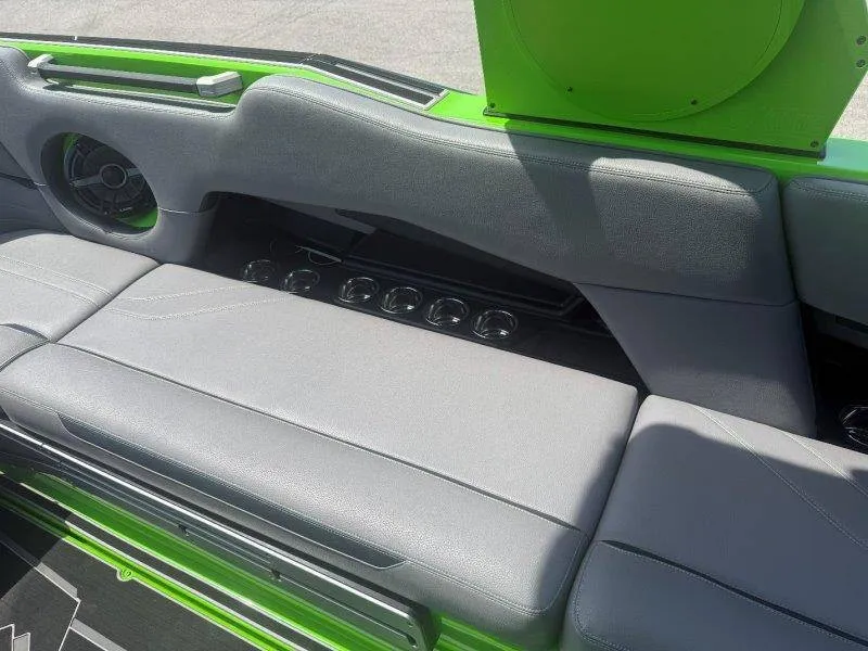 Slide: The Image of The image shows the gray upholstery of a 2023 Supra SE 550 with green accents. - 44