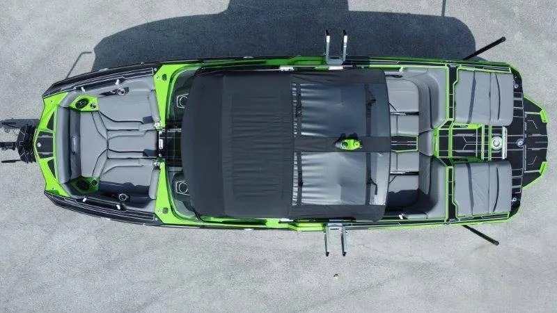 Slide: The Image of Aerial view of a 2023 Supra SE 550 boat with gray and green seating. - 5