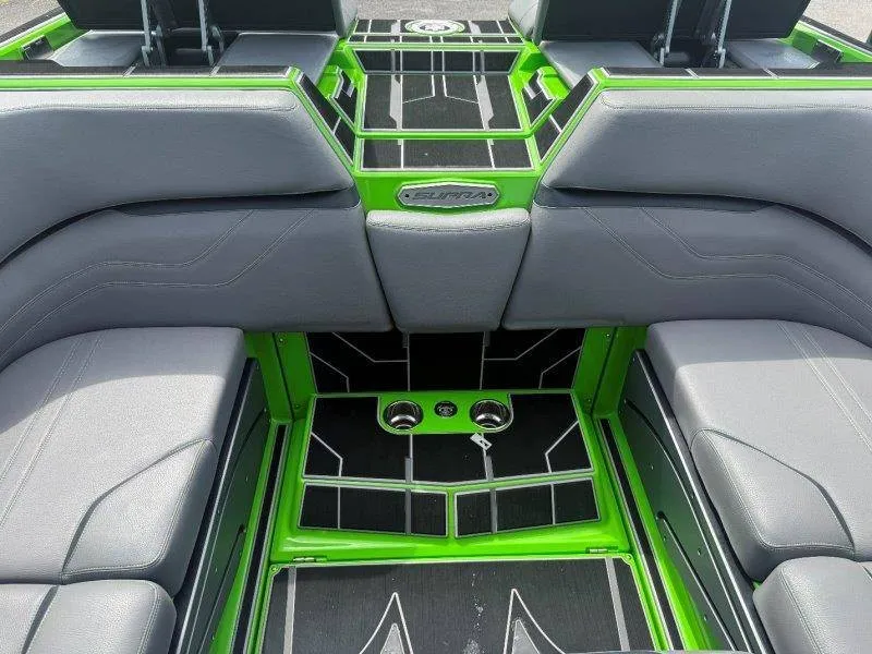 Slide: The Image of The image shows the interior of a 2023 Supra SE 550 boat with gray and green accents. - 27