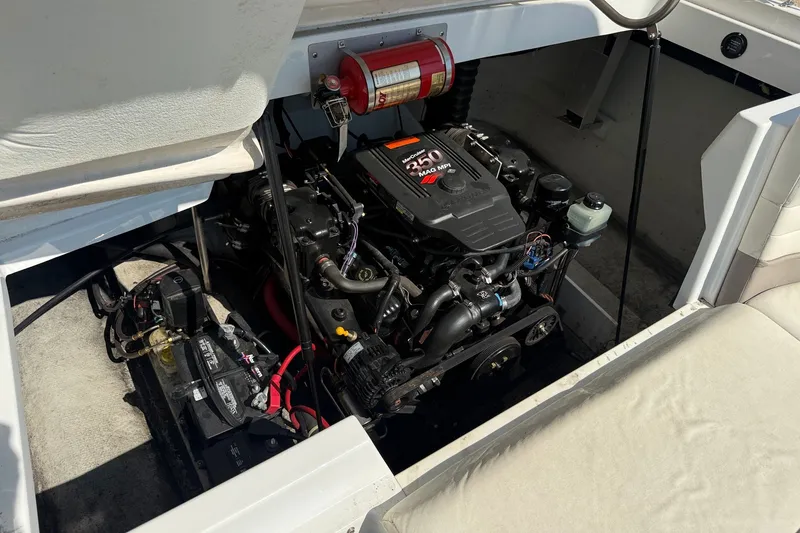 Slide: The Image of Engine compartment of a 2003 Cobalt 246 boat, featuring a MerCruiser 350 MPI engine. - 12