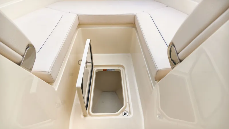 Slide: The Image of The 2022 Chris-Craft Calypso 27 features an open storage compartment with a hatch in the floor. - 19