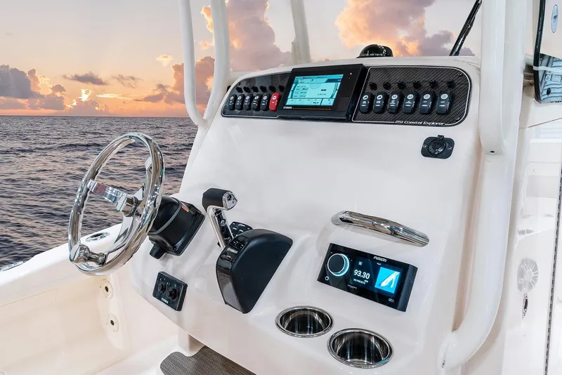 Slide: The Image of Manufacturer Provided Image: 2023 Grady-White 251 Coastal Explorer helm with modern controls at sunset. - 5