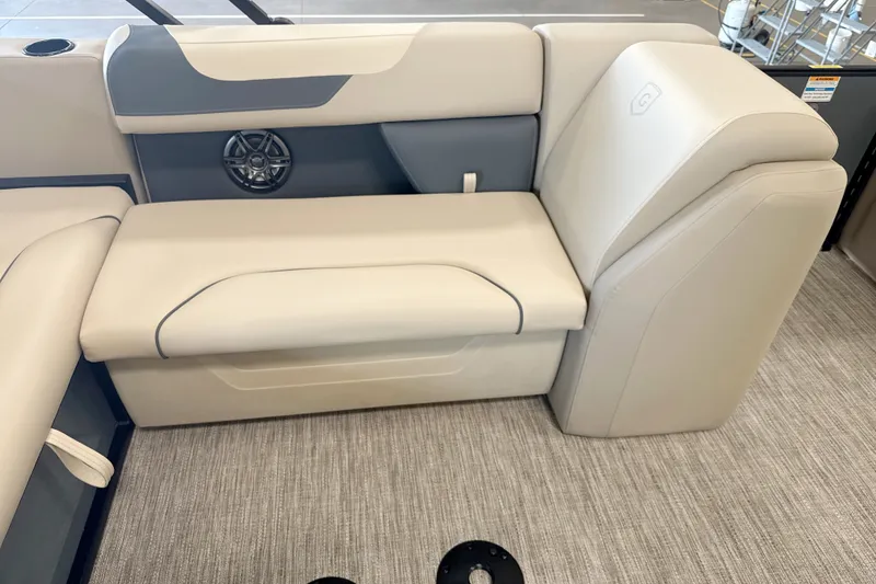 Slide: The Image of Interior seating of 2027 Godfrey Sweetwater 2286 SFL pontoon boat, featuring beige upholstery. - 11