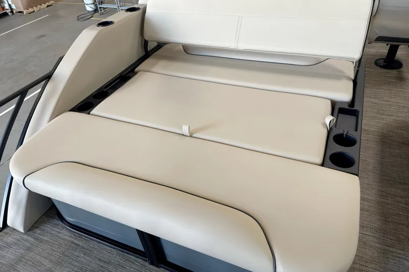 Slide: The Image of 2027 Godfrey Sweetwater 2286 SFL boat seating with cup holders, beige upholstery. - 6