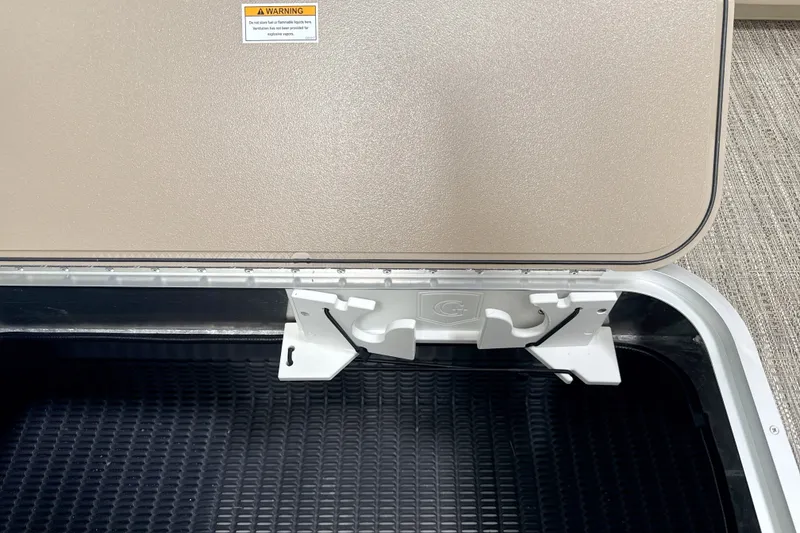 Slide: The Image of Storage compartment of 2027 Godfrey Sweetwater 2286 SFL boat with warning label. - 12