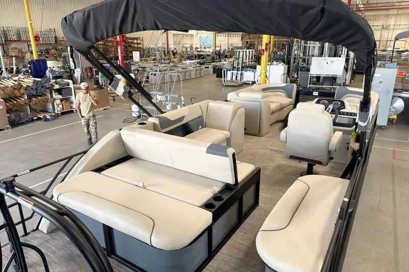 Slide: The Image of 2027 Godfrey Sweetwater 2286 SFL pontoon boat interior in a factory setting. - 16