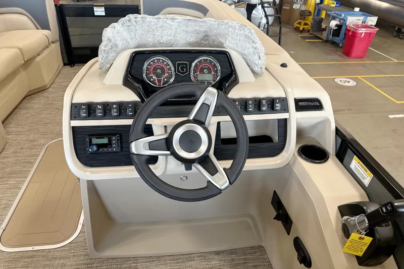 Slide: The Image of Steering console of 2027 Godfrey Sweetwater 2286 SFL pontoon boat in a showroom. - 8