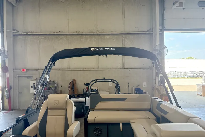 Slide: The Image of 2027 Godfrey Sweetwater 2286 SFL pontoon boat in a warehouse setting. - 15