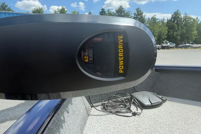 Slide: The Image of 2020 Tracker Pro Guide V-16 WT boat with PowerDrive motor, outdoors on a sunny day. - 16
