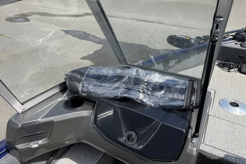 Slide: The Image of 2020 Tracker Pro Guide V-16 WT boat interior with windshield and wrapped accessory. - 17