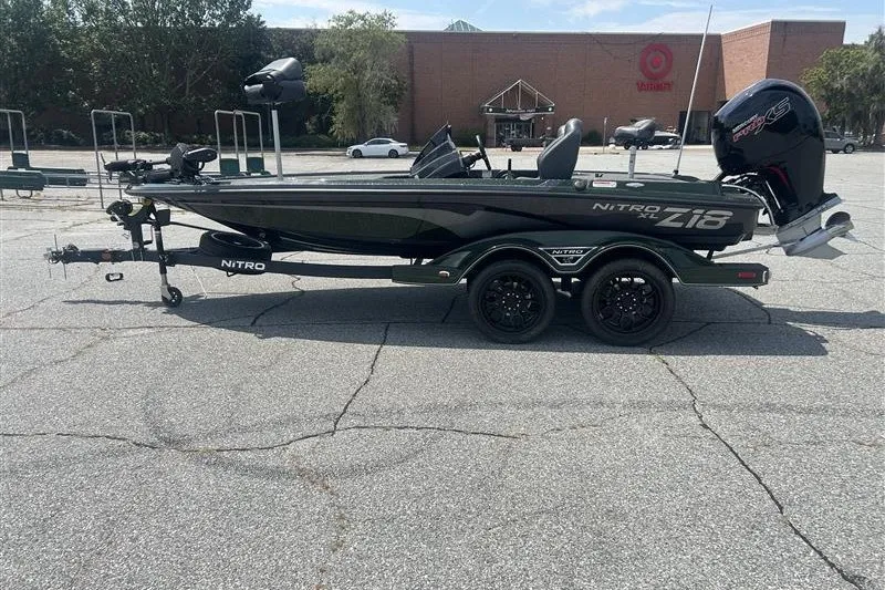 The Image of 2027 Nitro Z18 XL Pro boat parked in a lot, side view. - 0
