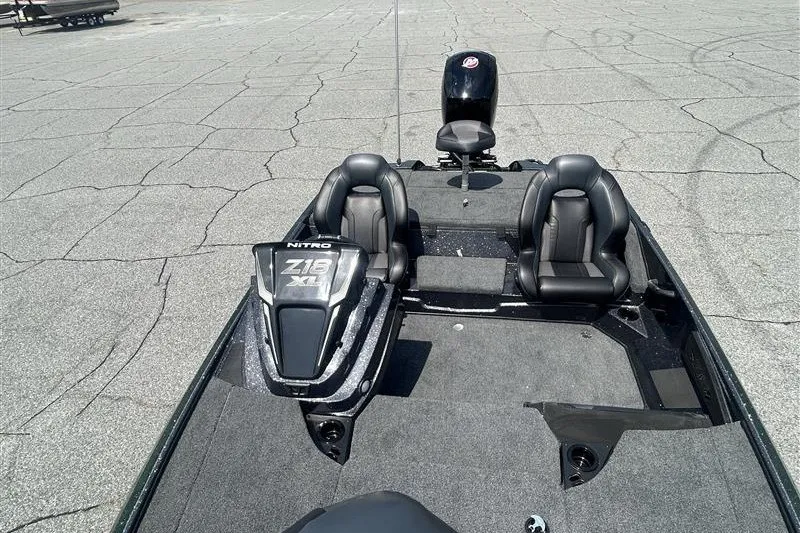 Slide: The Image of 2027 Nitro Z18 XL Pro boat with dual seats and sleek design on a paved surface. - 8