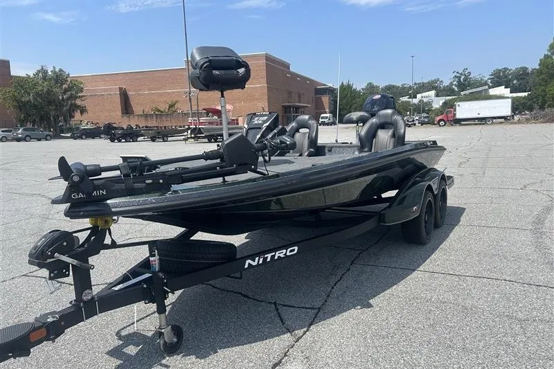 Slide: The Image of 2027 Nitro Z18 XL Pro boat in parking lot, featuring dual seats and Garmin equipment. - 1