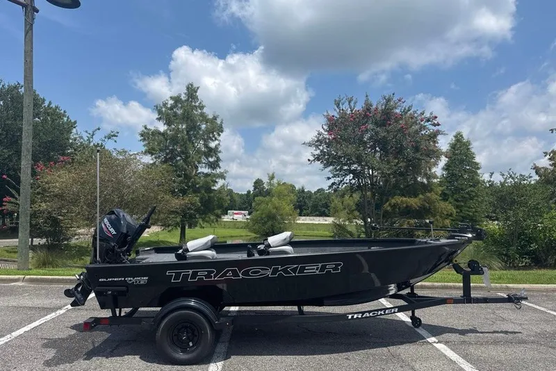 The Image of 2027 Tracker Super Guide V-16 T boat on trailer in scenic outdoor setting. - 0