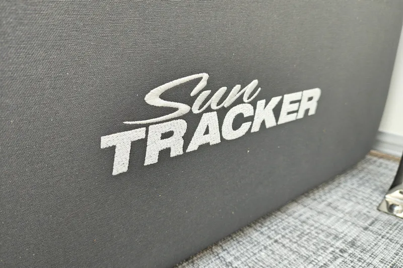Slide: The Image of Sun Tracker logo on 2027 Party Barge 22 DLX boat interior. - 22