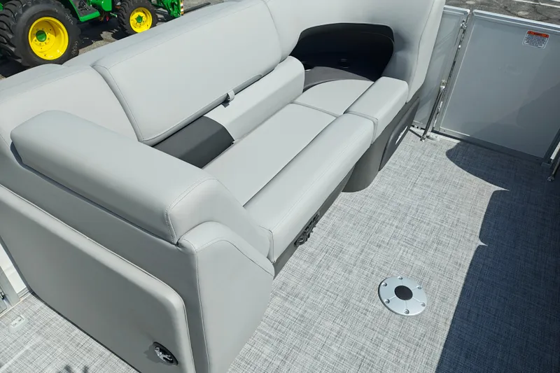 Slide: The Image of 2027 Sun Tracker Party Barge 22 DLX interior with gray seating and flooring. - 28